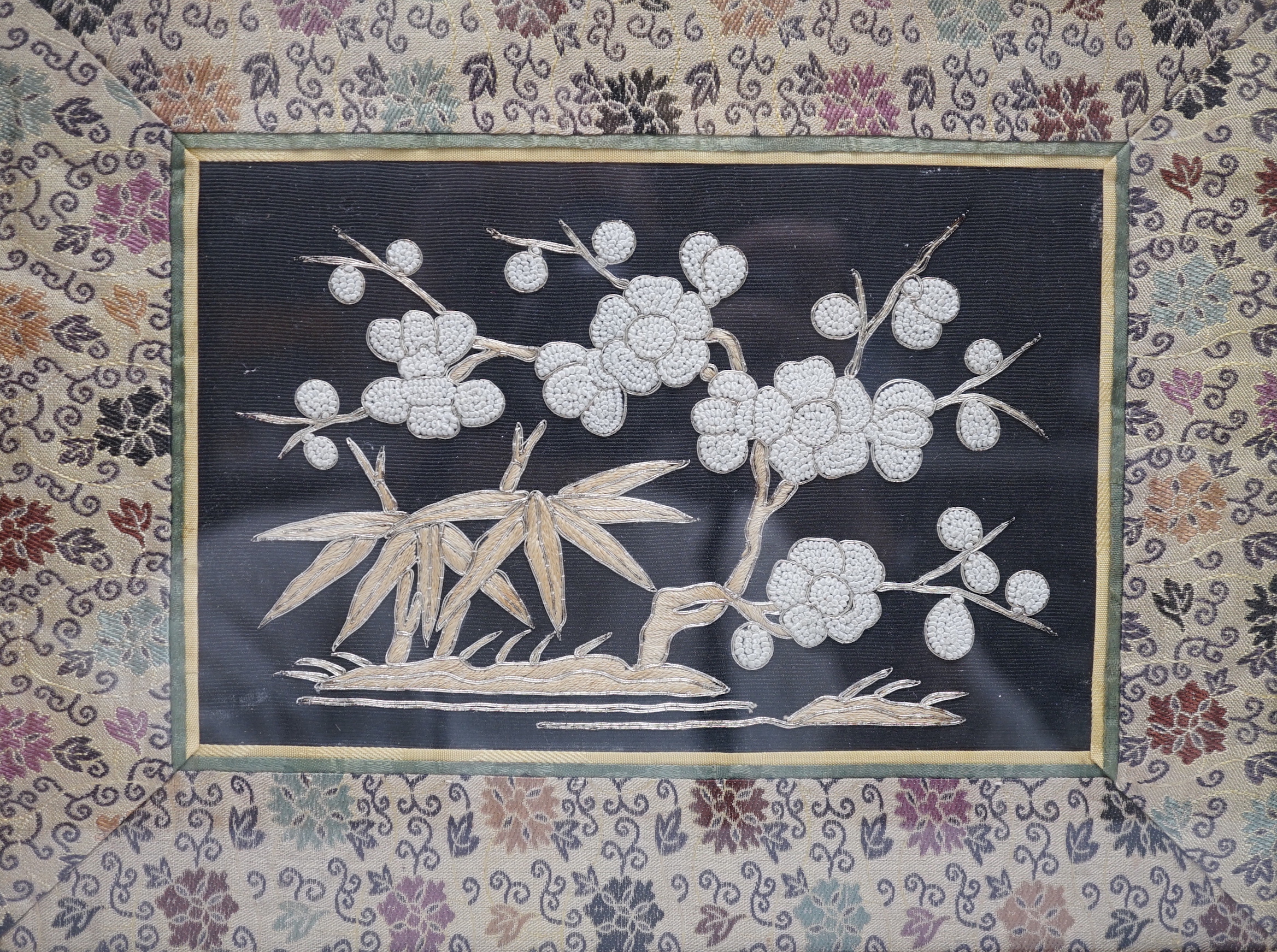 Three framed Chinese silk embroidered panels including a Beijing knot embroidered panel, two with applied butterflies, largest frame 31cm x 31cm